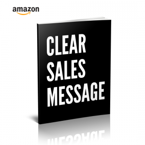Black book with the title clear sales message in bold white letters amazon logo top left reflected on a white surface