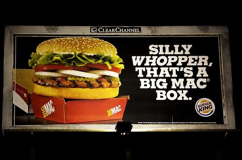 76b7ed70a55ac4747a5847a68d4a23fe Billboard advertising a whopper in a mcdonalds big mac box with the text silly whopper thats a big mac box