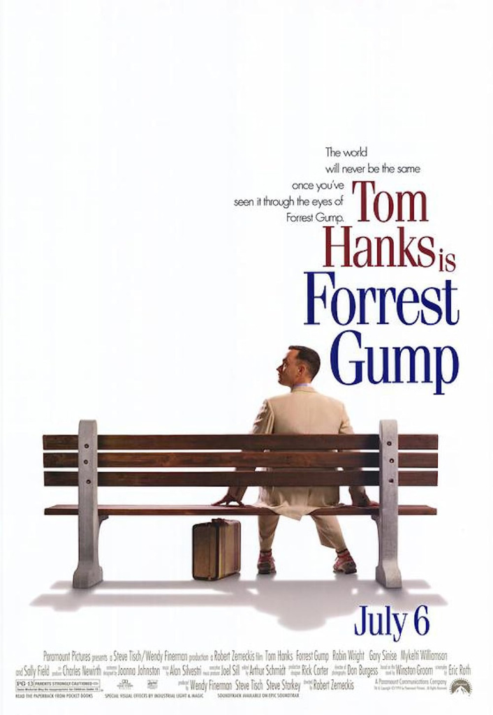 Tom hanks as forrest gump sits on a bench with a brown suitcase nearby the poster title is forrest gump in large blue letters on the right