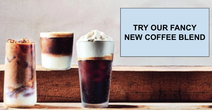 Three layered iced coffee drinks on a wooden counter beside a light blue promo badge reading try our fancy new coffee blend