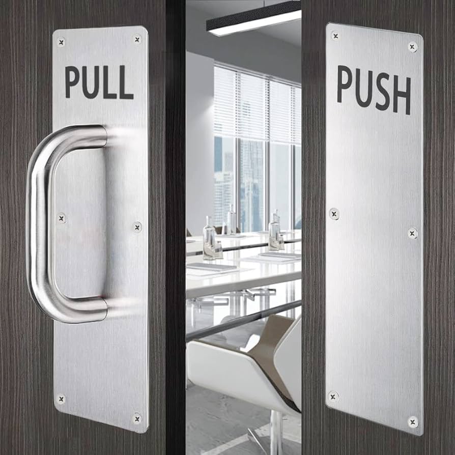 61hqmx3t8el ac uf8941000 ql80 Double doors with metal pull and push plates a bright conference room visible through the doorway