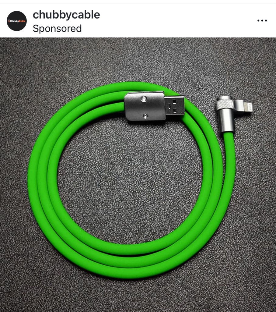 Bright green usb charging cable curled in a circle on a dark textured surface usb a and usb c connectors visible