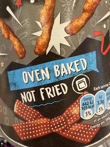 Packaging for oven baked not fried snacks with a blue ribbon banner and red polka dot bow chili coated sticks above