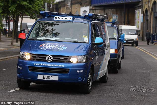 Blue pimlico plumbers van with on call sign driving on a city street plumbing service in action