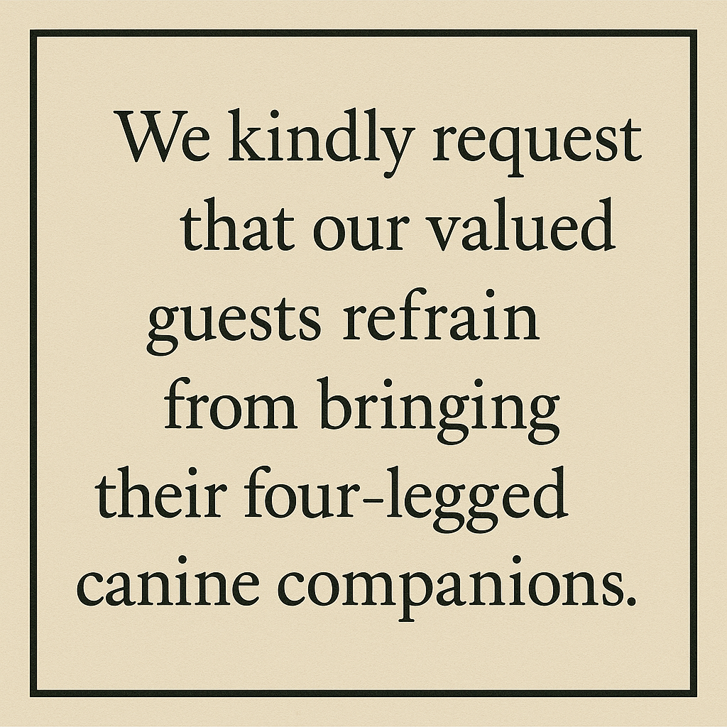 Beige sign in a black frame asking guests not to bring their dogs