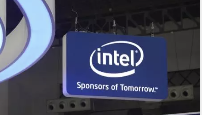 Blue hanging sign with intel logo and the words sponsors of tomorrow at a tech event