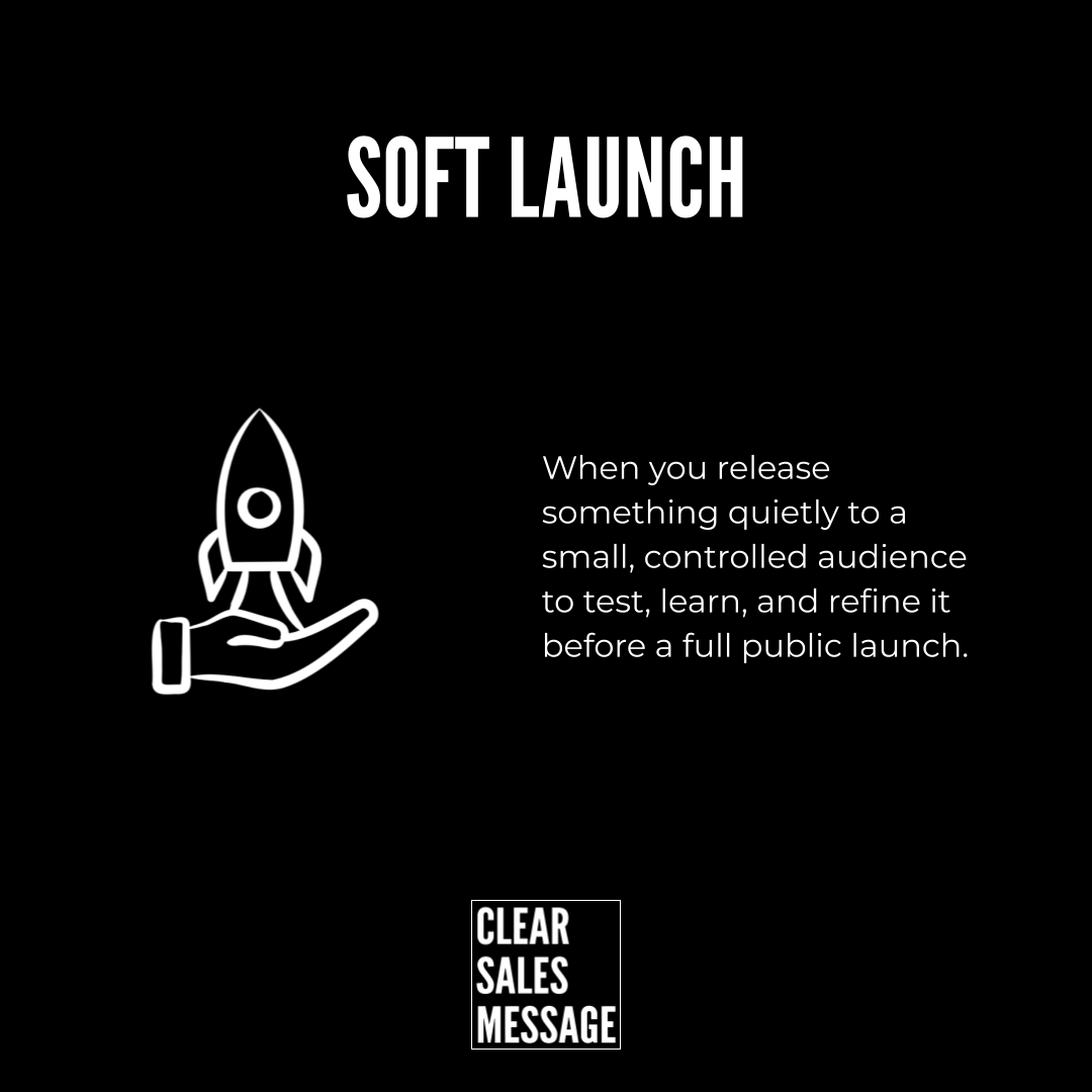 Soft launch Black page with the heading soft launch a white outline rocket cradled in a hand on the left and a right side paragraph about quietly testing before a full launch a small clear sales message logo at the bottom