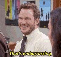 Thats embarrassing Smiling man in a light shirt and tie as subtitles read thats embarrassing