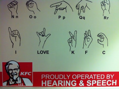 Asl alphabet chart showing hand signs for n o p q r and i k f c with the word love in the middle and a kfc banner at bottom
