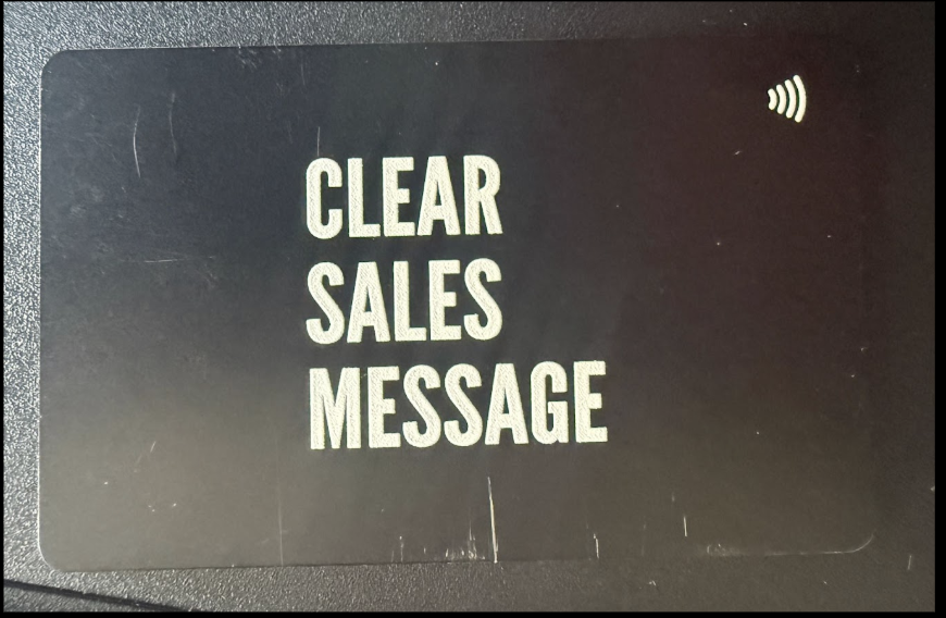 Screenshot 2026 08 24 at 074528 Panel on a dark device displaying the words clear sales message with a small wireless icon in the top right corner