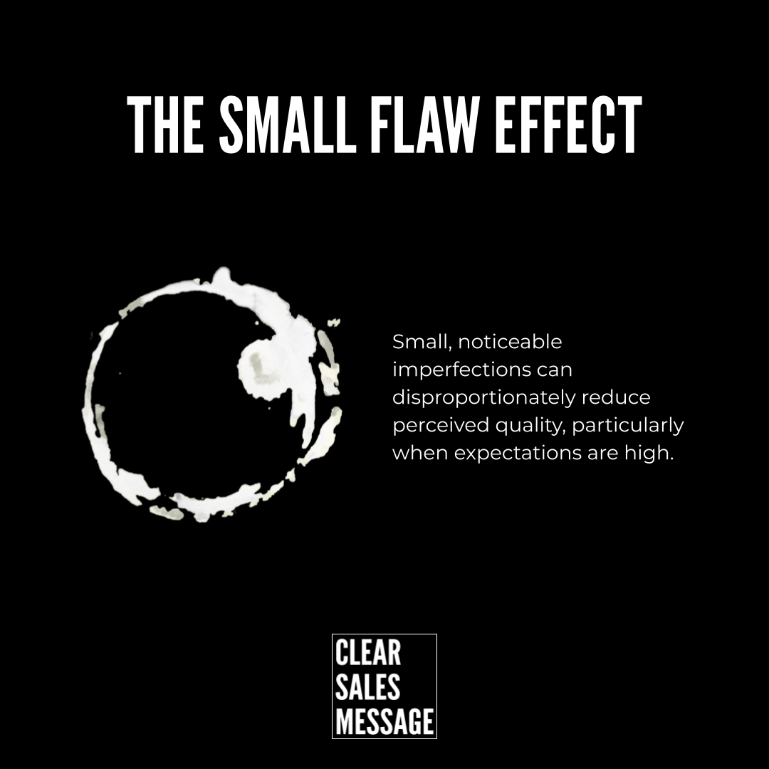 The small flaw effect Black poster with the title the small flaw effect a white circular brush mark on the left and a right aligned paragraph about how small imperfections affect perceived quality plus a clear sales message logo at the bottom