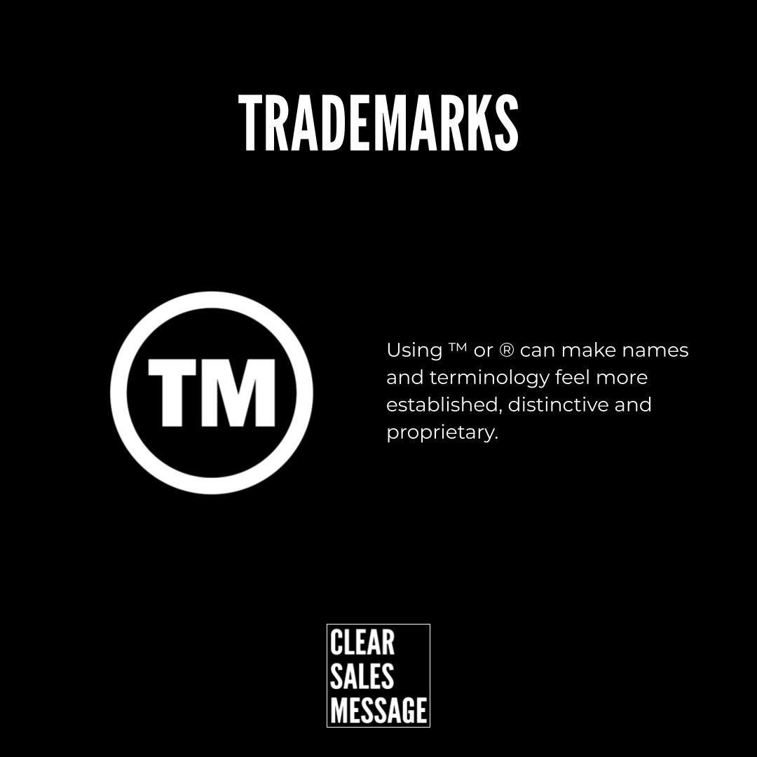 Black page showing a trademarks heading a circular tm symbol on the left and descriptive text about using tm or ® small clear sales message logo at bottom