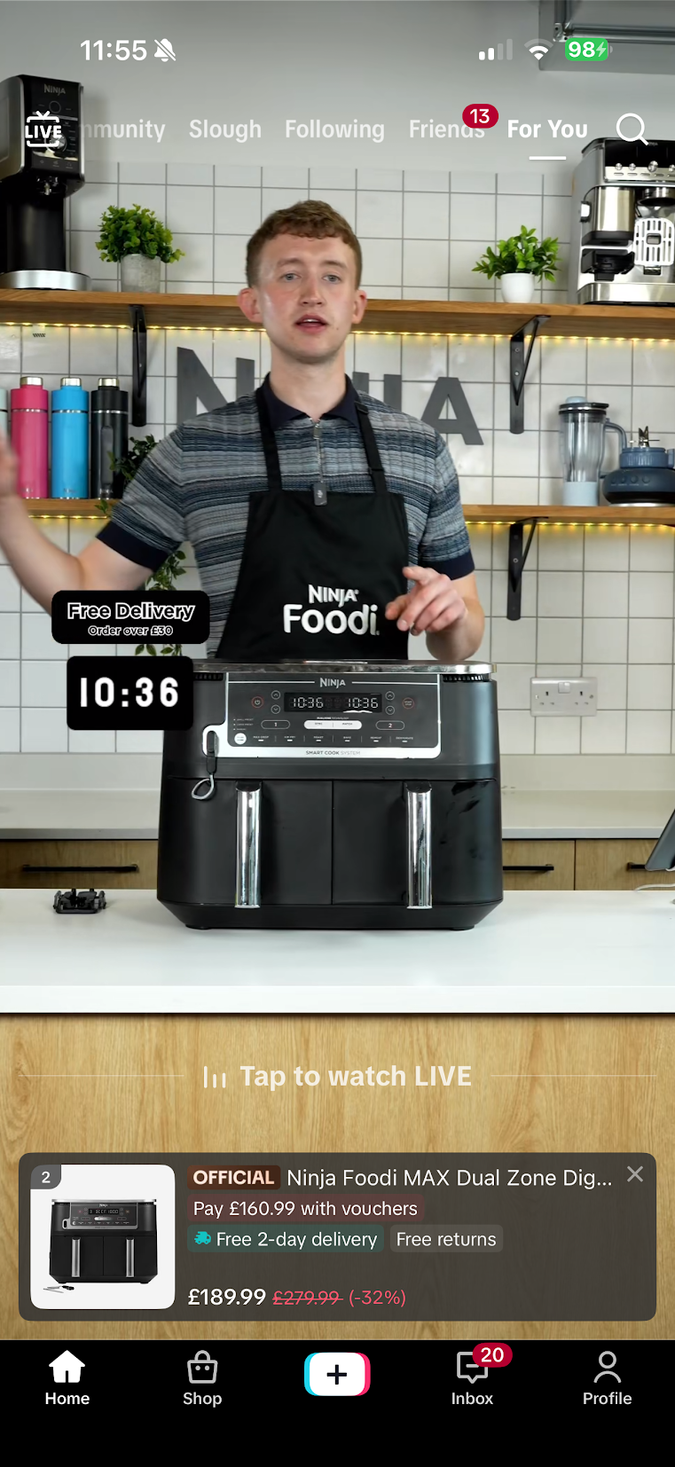 Man in a striped shirt and black ninja foodi apron stands behind a counter with a ninja foodi max air fryer live stream ui overlays are visible in the scene
